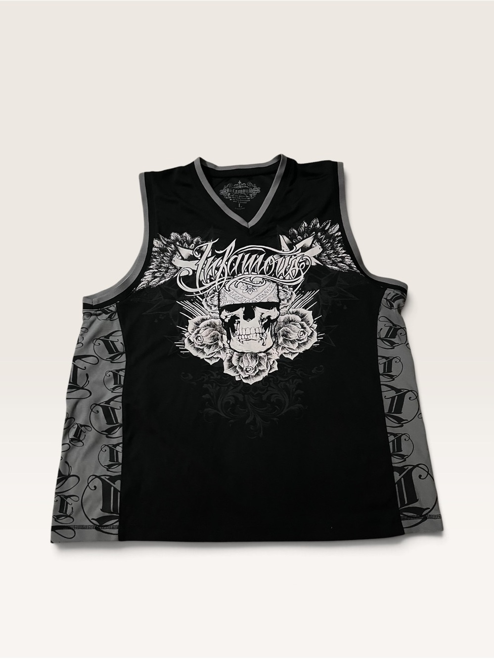 vintage Y2K-era "Infamous" sleeveless graphic jersey.
